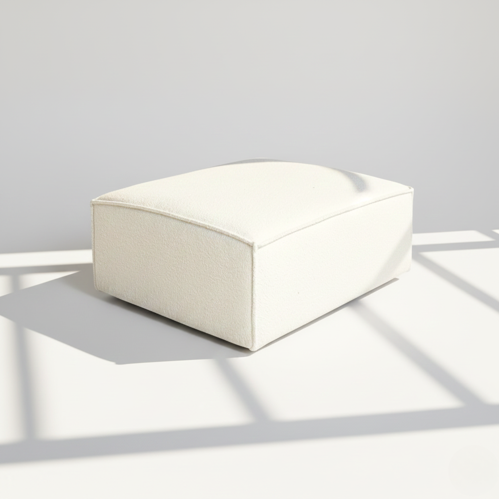 Aire footstool in ivory boucle
